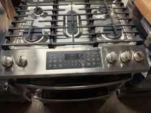 Load image into Gallery viewer, Gas cooktop close-up